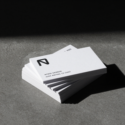 Stacked Cards on Dark Concrete